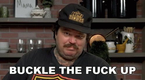 A Man Wearing A Hat That Says " Cycle Zombies " GIF