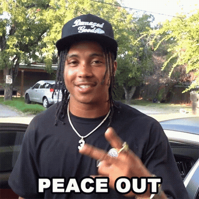 A Man Wearing A Hat That Says Damaged Goods Is Giving The Peace Sign GIF