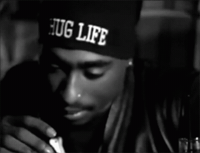 A Man Wearing A Hat That Says Hug Life On It GIF