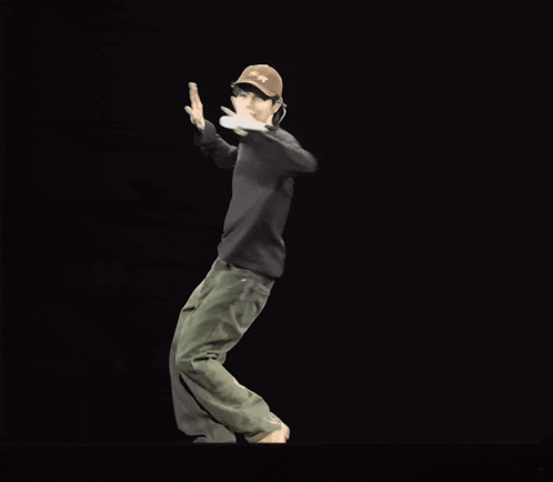 a man wearing a hat that says jeep is dancing