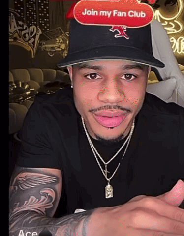 A Man Wearing A Hat That Says Join My Fan Club On The Top GIF