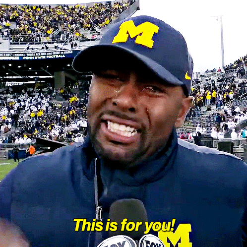 A Man Wearing A Hat That Says M On It GIF
