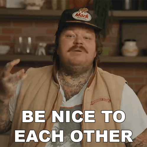 A Man Wearing A Hat That Says Mack On It Says Be Nice To Each Other GIF