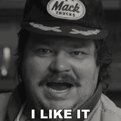 A Man Wearing A Hat That Says Mack Trucks Says I Like It GIF