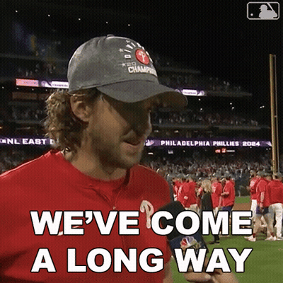 A Man Wearing A Hat That Says Philadelphia Phillies 2014 On It GIF