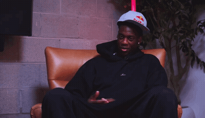 A Man Wearing A Hat That Says Red Bull On It GIF
