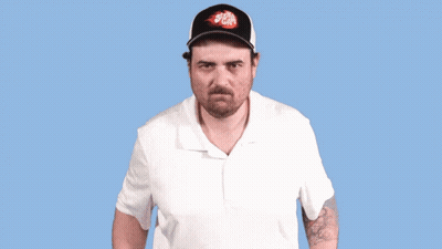 A Man Wearing A Hat That Says Stella Artois Makes A Funny Face GIF