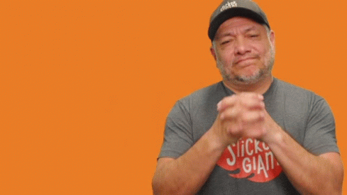 A Man Wearing A Hat That Says Stickers Giant GIF