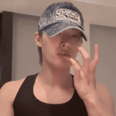 A Man Wearing A Hat That Says ' Stuck On ' On It GIF