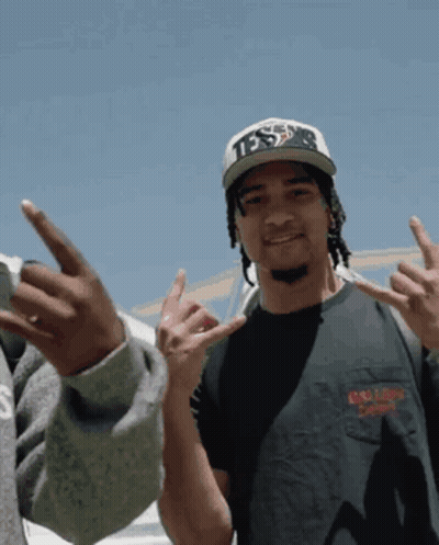 A Man Wearing A Hat That Says Tds Is Giving The Middle Finger GIF