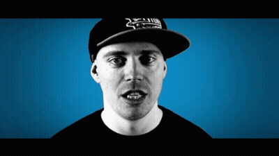 A Man Wearing A Hat That Says ' Xtreme ' On It Looks At The Camera GIF