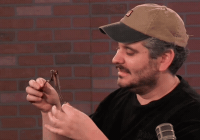 A Man Wearing A Hat With The Letter A On It GIF