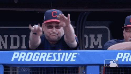 A Man Wearing A Hat With The Letter C On It Is Giving The Middle Finger GIF