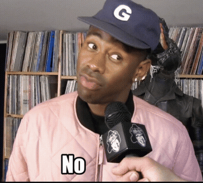 A Man Wearing A Hat With The Letter G On It Is Holding A Microphone And Says No GIF