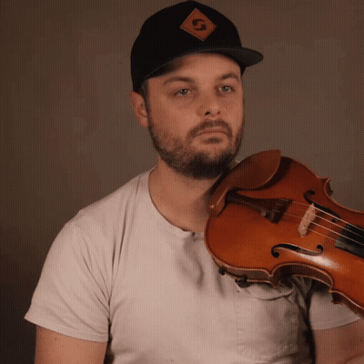 A Man Wearing A Hat With The Letter G On It GIF