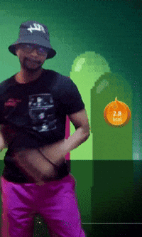 A Man Wearing A Hat With The Letter T On It Is Standing In Front Of A Green Background GIF
