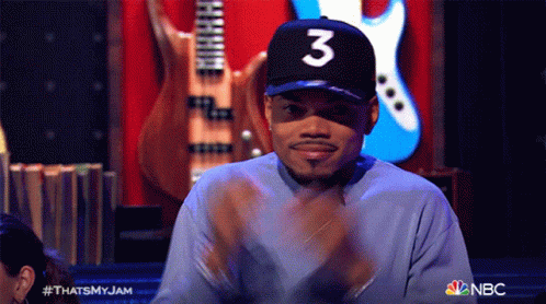 A Man Wearing A Hat With The Number 3 On It Is Clapping GIF