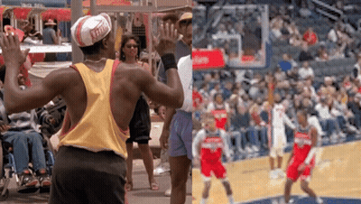 A Man Wearing A Hat With The Word Ferrari On It Stands In Front Of A Basketball Court GIF