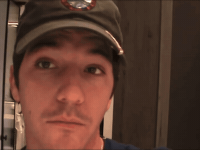 A Man Wearing A Hat With The Word Main On It GIF