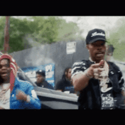 A Man Wearing A Hat With The Word Yankees On It Is Pointing GIF