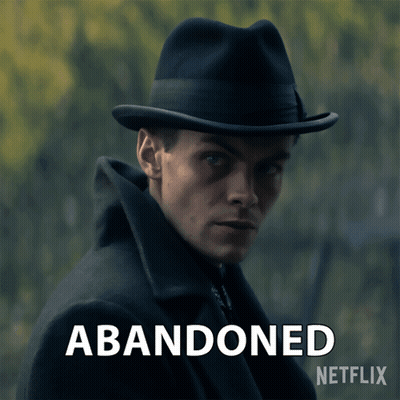 A Man Wearing A Hat With The Words Abandoned Written Below Him GIF