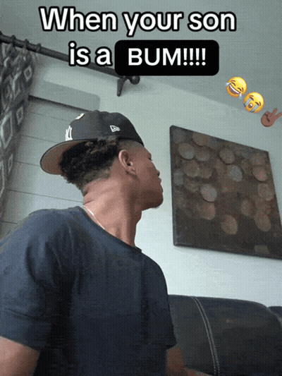 A Man Wearing A Hat With The Words When Your Son Is A Bum Written On It GIF