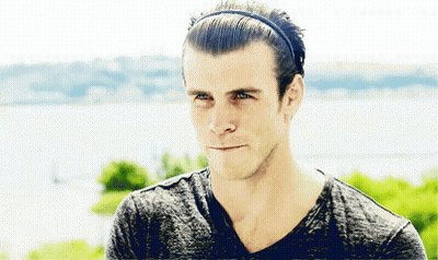 A Man Wearing A Headband And A Gray Shirt GIF