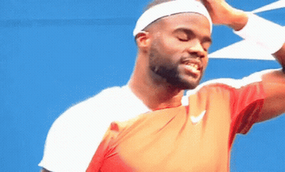 A Man Wearing A Headband And A Nike Shirt Is Smiling With His Eyes Closed GIF