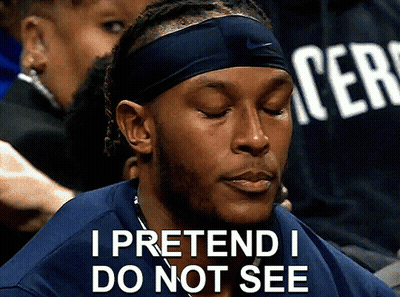 A Man Wearing A Headband And A Shirt That Says " I Pretend I Do Not See " GIF