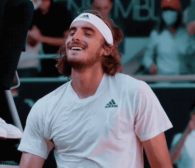 A Man Wearing A Headband And An Adidas Shirt Is Smiling GIF