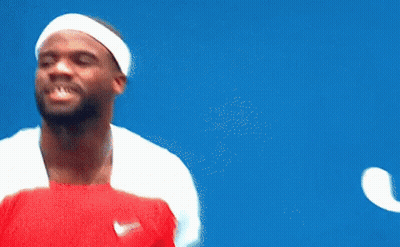 A Man Wearing A Headband And Holding A Tennis Racquet Looks Up At The Sky GIF
