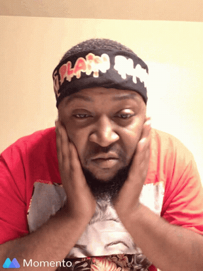 A Man Wearing A Headband That Says Flash On It Holds His Hands To His Face GIF