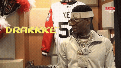 A Man Wearing A Headband That Says Gucci Is Standing In A Locker Room GIF