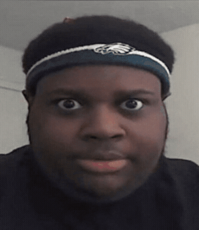 A Man Wearing A Headband With An Eagle On It GIF