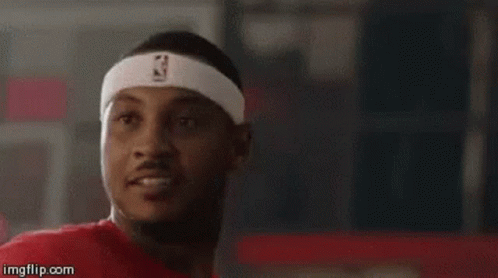 A Man Wearing A Headband With The Nba Logo On It Is Looking At The Camera . GIF