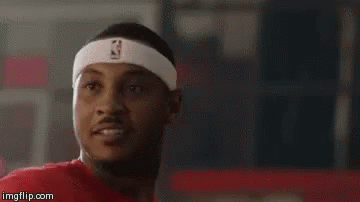 A Man Wearing A Headband With The Nba Logo On It Is Looking At The Camera . GIF