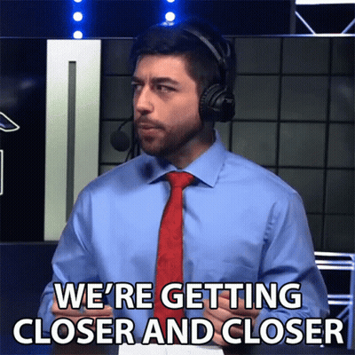 A Man Wearing A Headset And A Tie Says We 'Re Getting Closer And Closer GIF