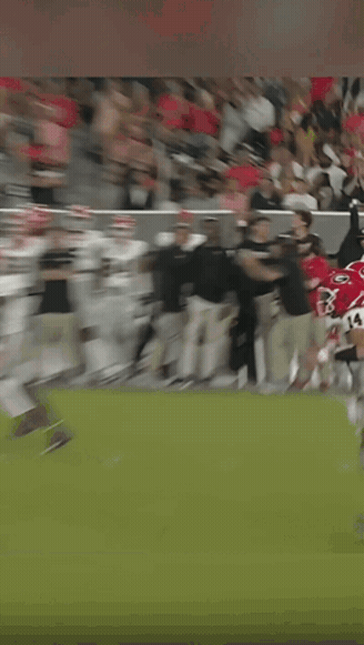 A Man Wearing A Headset Is Running On A Field GIF