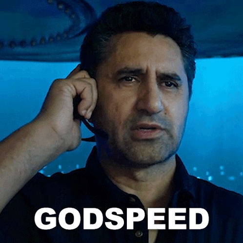 A Man Wearing A Headset Is Talking On A Cell Phone With The Word Godspeed Written Below Him GIF