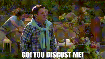 A Man Wearing A Headset Says `` Go ! You Disgust Me ! '' While Standing In A Garden . GIF