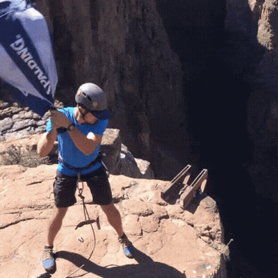 A Man Wearing A Helmet And A Blue Shirt That Says Spalding On It GIF