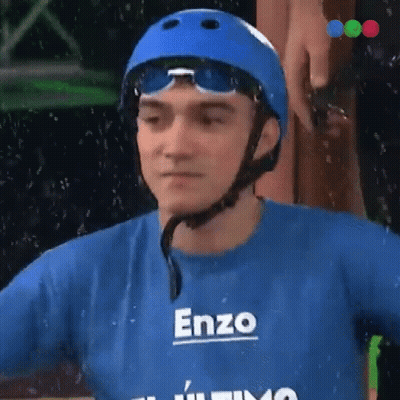 A Man Wearing A Helmet And A Blue Shirt With The Name Enzo On It GIF