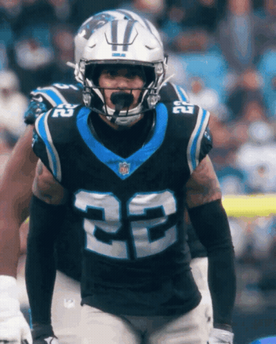 A Man Wearing A Helmet And A Jersey With The Number 22 On It GIF