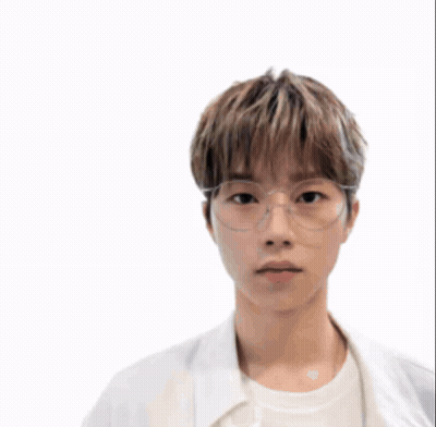 A Man Wearing A Helmet And Glasses Stands In Front Of A Battle Scene GIF