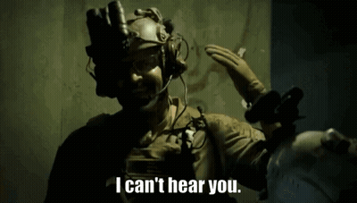 A Man Wearing A Helmet And Gloves Says I Can 'T Hear You GIF