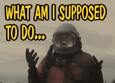 A Man Wearing A Helmet And Gloves Says What Am I Supposed To Do GIF