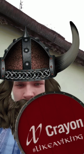 A Man Wearing A Helmet And Holding A Red Shield That Says Crayon GIF