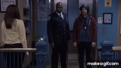 A Man Wearing A Helmet Is Giving A High Five GIF