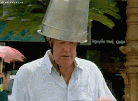 a man wearing a helmet with a bucket on top of his head