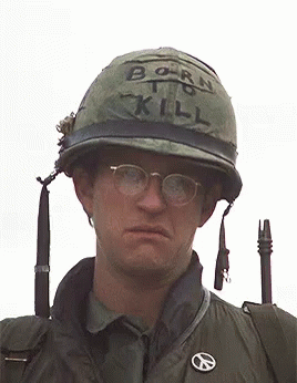 A Man Wearing A Helmet With Born To Kill Written On It GIF